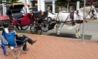 Waiting for a customer in Old Town Eureka, Behind: Panorama of Old Town