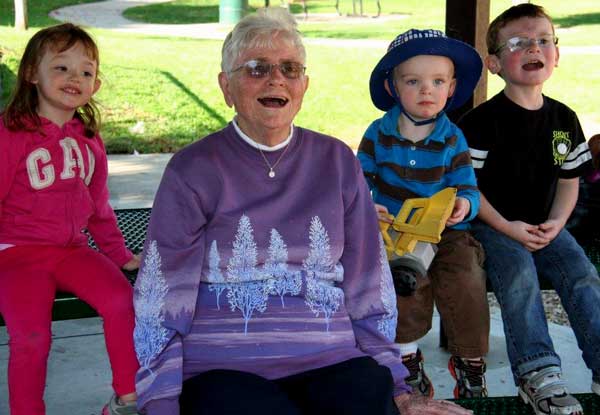 Great Grandma with her three great grand children, Behind: Chloe and cousin Daniel