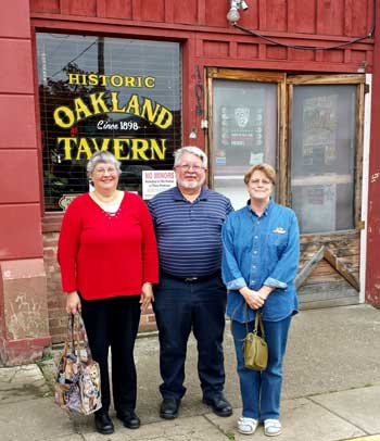 Anita, Jay and Gwen in front of our lunch location, Behind: A larger view of this historic building