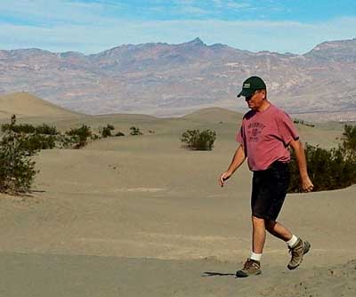 Exploring Mesquite Flat Dunes near Stove Pipe Wells, Behind: Playing with a dunes photo