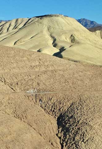 Zabriskie Point from below the view area, Behind: View into the Badland