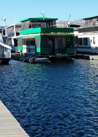 A houseboat in the marina, one of many, Behind: a panorama of the many houseboats