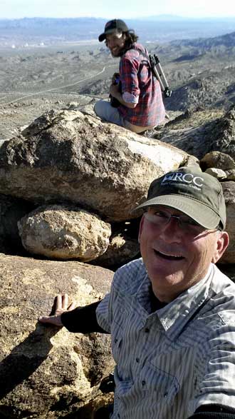 Dale and Eric reach the top, Behind: a panorma from the top