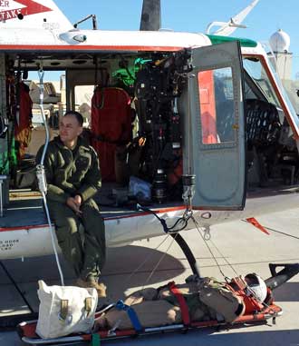 Rescue helicopter with Humvee behind