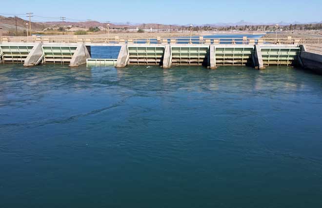 The All American Canal, Behind: Clearing the debris from the dam outlets