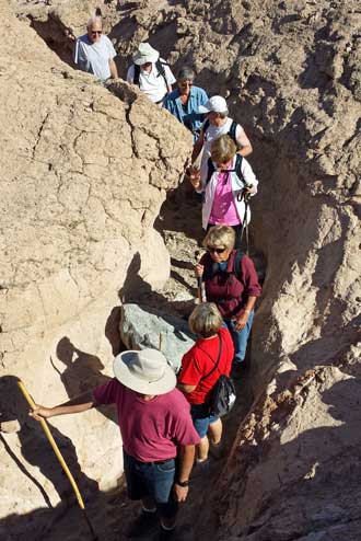 Entering the slot canyon, Behind: Hiking deeper into the slot canyon