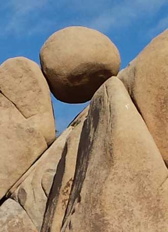 We are surrounded by unusual rocks, Behind: A sign marking the trail crossing the park