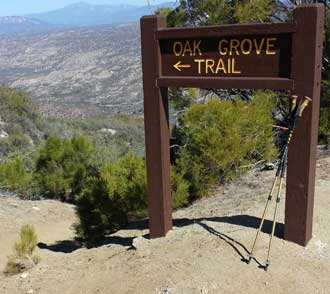 The single track, Oak Grove Trail meets the Oak Grove Road to the summit, Behind: Panorama of the valley, Behind: Panorama of the valley showing location of Jojoba Hills