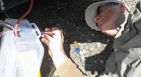 Replacing the plastic bin around the inverter, Behind: Alumascape parked in storage