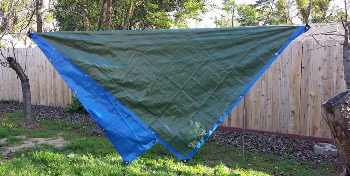 Setting up the tarp before the hammock, Behind: guy lines installed