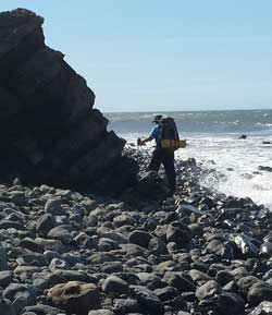 Dodging the surf around a point, Behind: waiting for the tide to go out