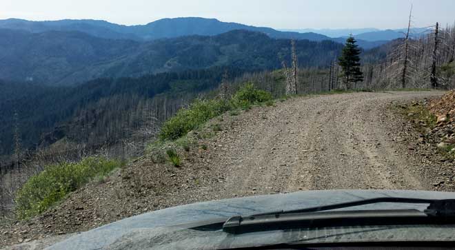 Driving to the Whitehorse Meadows Trailhead, Behind: Lindsay at the trailhead