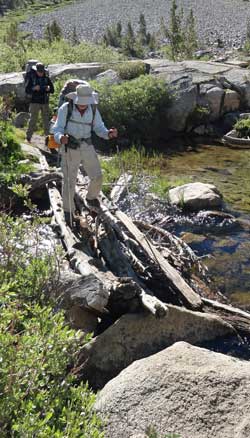 Numerous creek crossings, Behind: descending into Woods Creek valley