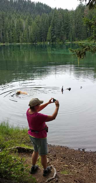 Gwen photographs the first Twin Lake, Behind: Gwen finds the second Twin Lake