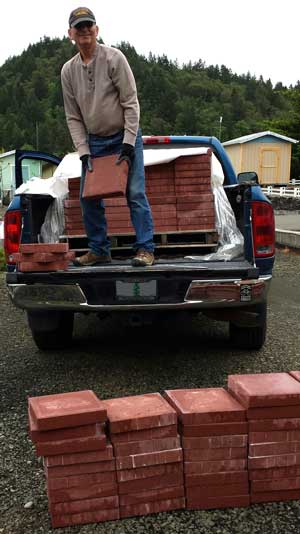 Unloading the new "deck", Behind: Dodging the rain