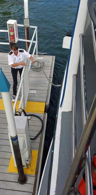 Releasing the dock line, Behind: On the observation deck of the USS Riverside