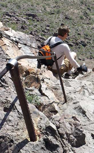 Steve on his way down, Behind: Panorama of the trail heading down