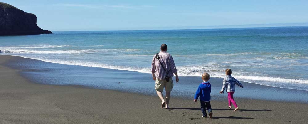 My son Ben, granddaughter Chloe and Grandson Noah on the beach