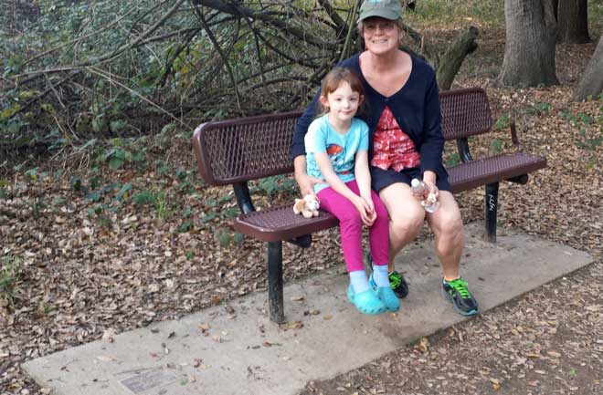 Gwen and Chloe enjoying Grandpa's bench.