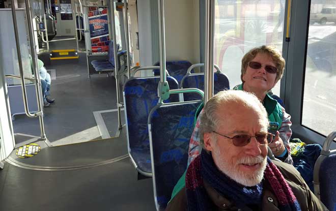 Gwen and Jack riding the Tucson trolley to the Arizona Bowl