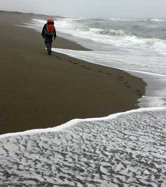 Dodging the waves looking for firmer sand, overcast on our second day