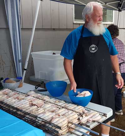 Larry has the chicken ready for the barbeque