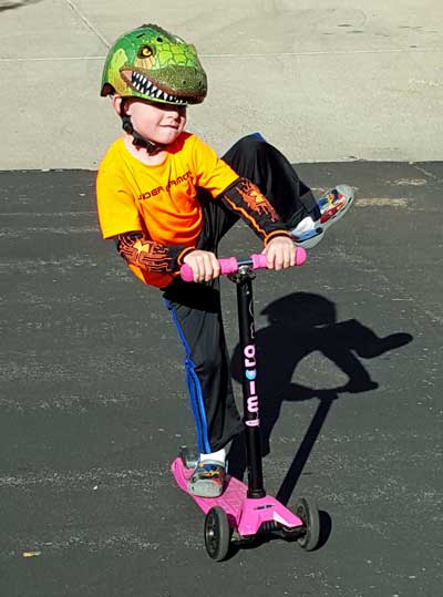 Noah does tricks on his scooter