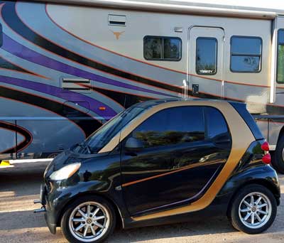 Matching motorhome and car next door