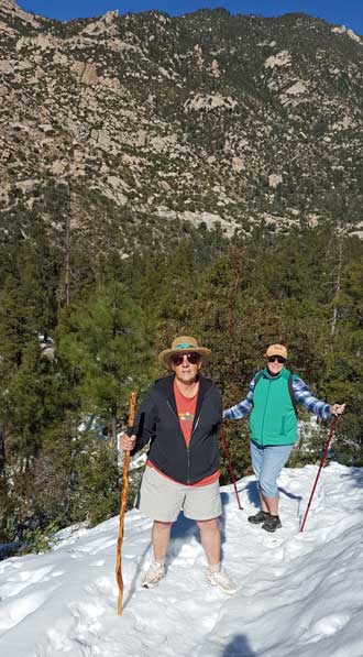 Gwen and Jeanne climbing in the snow