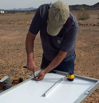 Gary is preparing a panel for mounting.