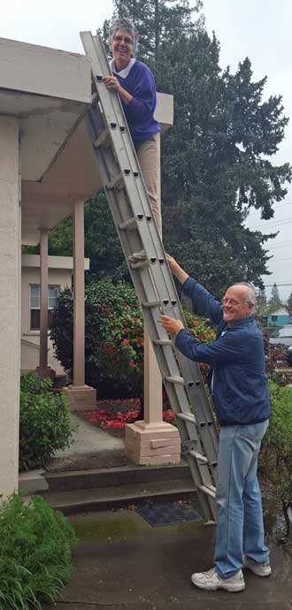 My sister clearing a downspout