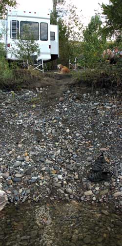 Standing in the Salmon River (it's cold) looking at our trailer only ten feet from the bank