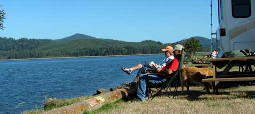 Reading a novel on the shore of Alsea Bay