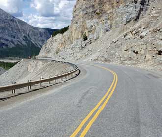 Two lane road, sometimes narrow with sharp turns