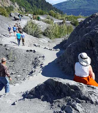 Gwen is watching the hikers come/go from the Exit glacier view point.