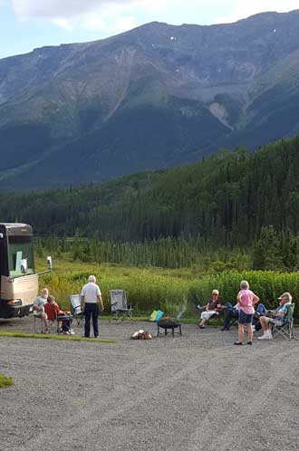 Setting up for a final campfire and Gwen making a game of a story she wrote