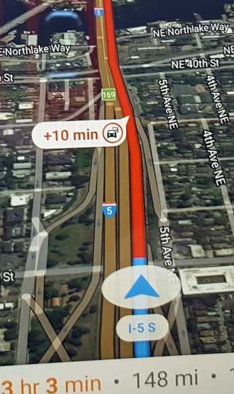 GPS is showing RED meaning traffic is crawling and Seattle view from I-5 traveling south