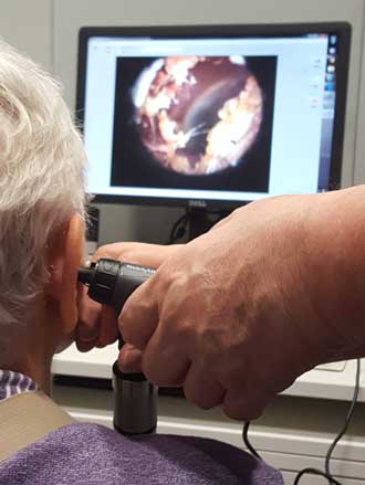 Mom is getting her hearing aids tuned up