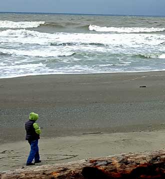 Gwen on the beach between bursts of rain