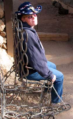 Gwen sitting in a horseshoe rocker