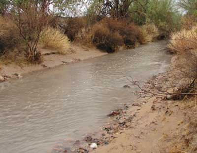 A wash running with water, rare