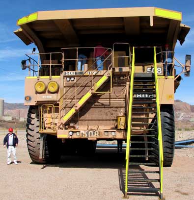 Huge trucks move the ore. The tires are 12 feet in diamete. Each truck costs $2.3 million.