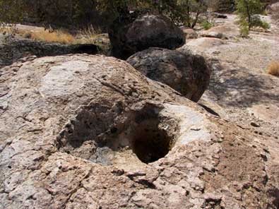 Grinding holes in the rocks at the top of the hill