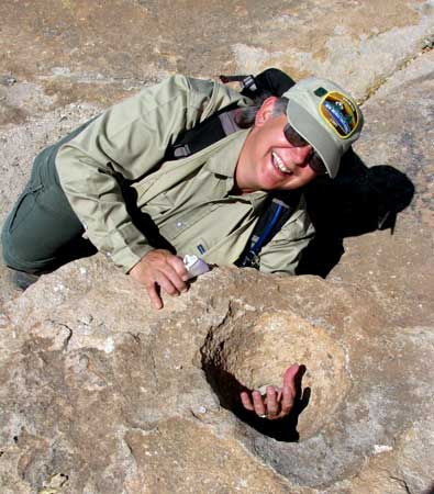 Debbie is clowning around after finding a grinding hole with no bottom. 