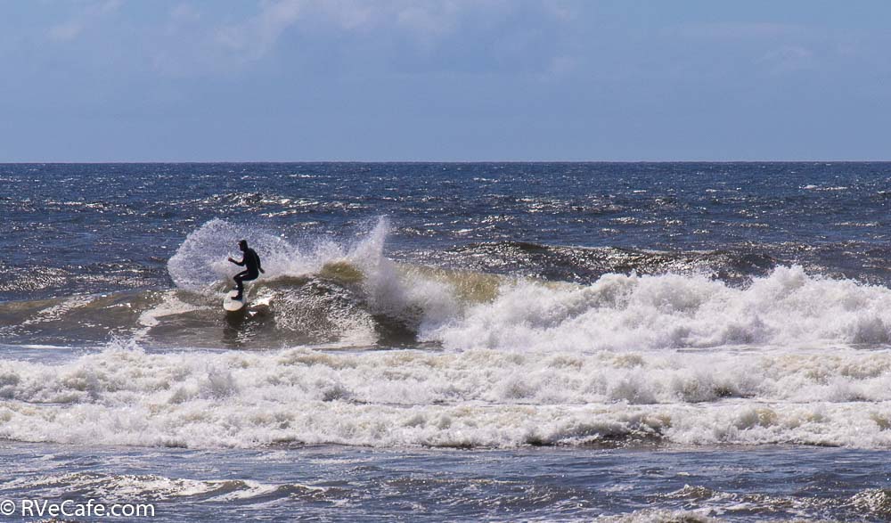 A surfer enjoying the waves off Bandon Beach