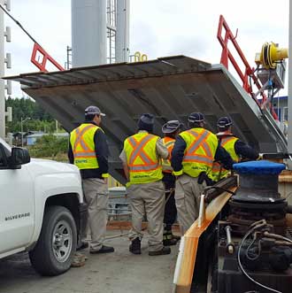 Crew watching the ramp descend