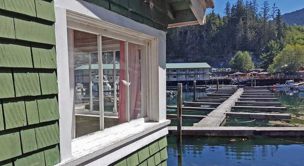 A view of the cove through a cottage window