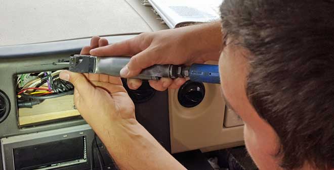 John is reshaping the dash to fit the new radio