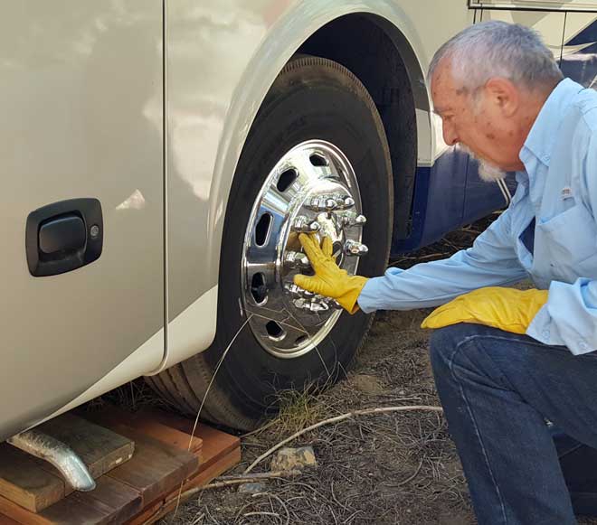 Ray shows me how to set the front wheel perfectly onto blocks