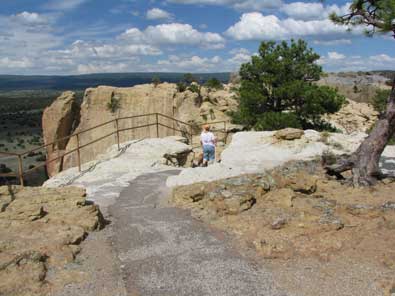 The view from the top is of grassy valleys below.